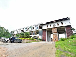 A multi-story building with a large entrance and a covered walkway. - DanCenter Kolpol Udaipur (Udaipur)