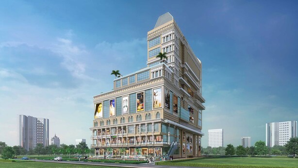 A multi-story building with a prominent tower, large windows, and a ground-level retail area. - Sunday Hotel by CheckIn Greater Noida (Greater Noida)