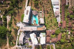An aerial view of a resort with a swimming pool, multiple buildings, and surrounding greenery. - Kamala - Green Jungle View (Kathu District)