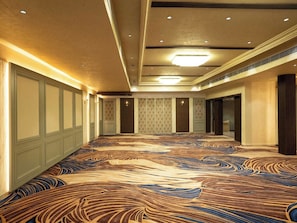 A spacious conference room with a patterned carpet, recessed lighting, and a high ceiling. - Palette Hotel by CheckIn Amritsar City (Amritsar)