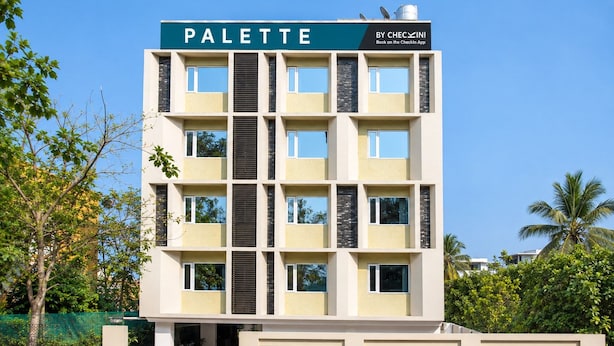 A multi-story building with a sign reading 'PALETTE' and 'BY CHEC XINI'. - Palette Hotel by CheckIn, Visakhapatnam (Visakhapatnam)