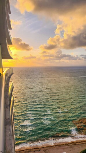 A coastal view with a balcony overlooking the sea and a sunset. - 30th Floor Two Condo Vacation Package in Hollywood (Hollywood)