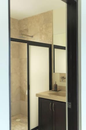 A bathroom with a shower, a sink, and a mirror. - Tranquil Cabo Villa w/ Private Pool, Grill & Patio (Cabo San Lucas)