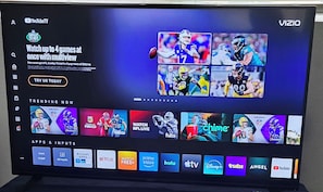 A television screen displaying a sports streaming interface with multiple game options and a 'TRY US TODAY' button. - Cozy 1-bedroom for rent in pleasant St. Petersburg with AC (St. Petersburg)