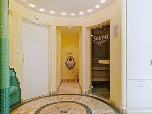 A hallway with a tiled floor, a sauna sign, and a door leading to a room. - Ferienhaus Brigitte by Interhome (Längenfeld)
