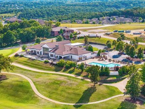 A residential area with a large house featuring a swimming pool, multiple driveways, and a well-maintained lawn. - Great Location! Fireplace! Luxury Bathrooms! (Branson)