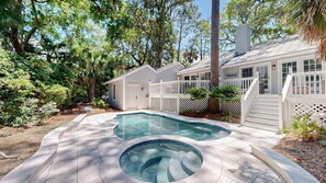 A residential property with a swimming pool, a fenced backyard, and a house with a white exterior. - New to VRBO, 5BR Palmetto Dunes, 7.5 Min Walk To Beach, Private Pool (Hilton Head Island)