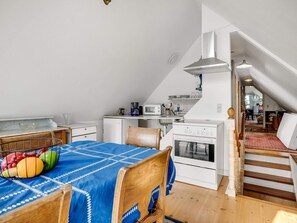 A compact kitchen with a microwave, coffee maker, and a small refrigerator. - 4 Person Holiday Home in Snedsted (Snedsted)
