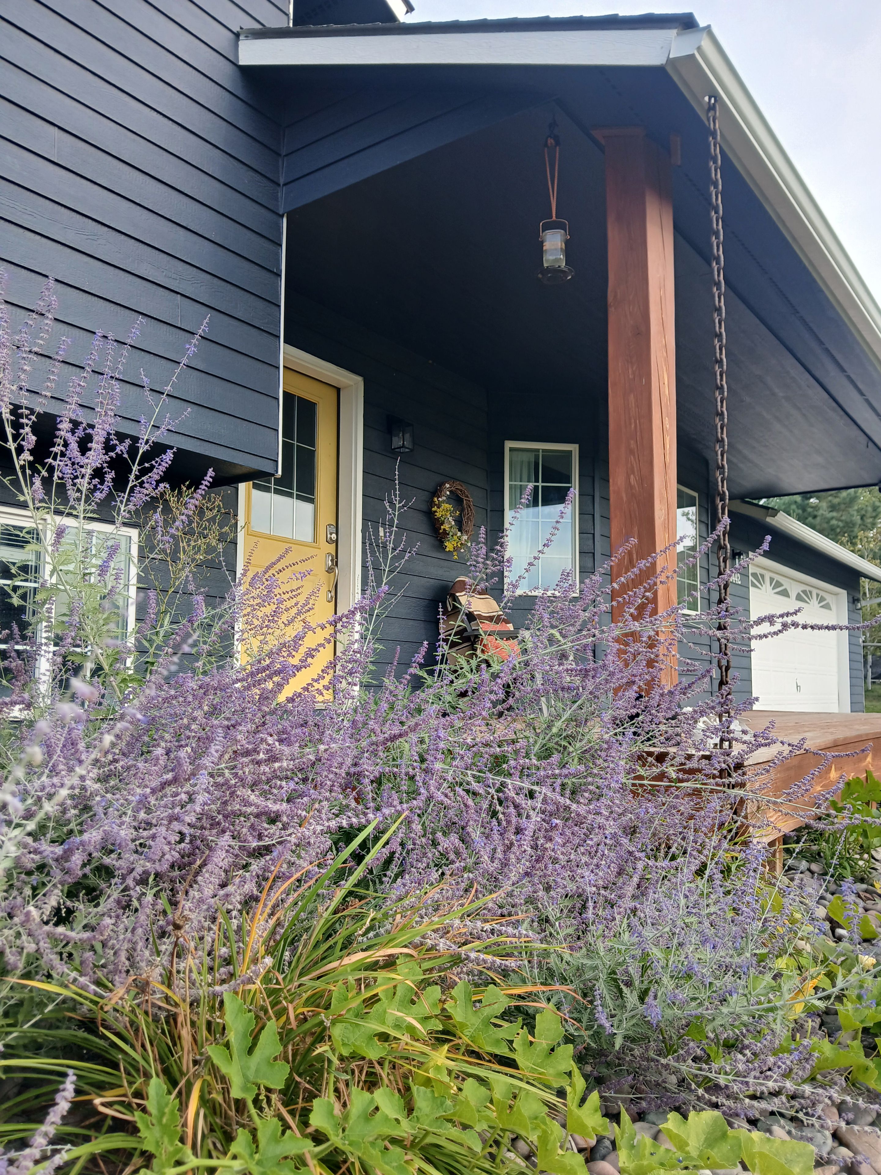 A house with a porch, a door, and a window.