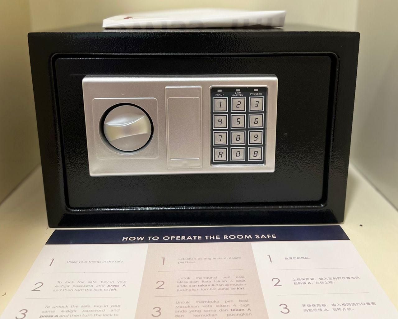 A safe with a keypad and instructions on how to operate it.