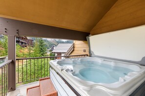 A hot tub on a balcony with a view of a mountainous area. - Ski-In/Ski-Out Schweitzer Chalet w/ Hot Tub (Sandpoint)
