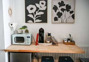 A kitchen counter with a microwave, coffee maker, and various kitchen items. - Cozy Stay Near Downtown St. Augustine Attractions (St. Augustine)