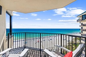 A balcony with a view of a beach and ocean. - Gulf-Front Condo! Beach Chairs, Balcony & 3 Pools (Panama City Beach)