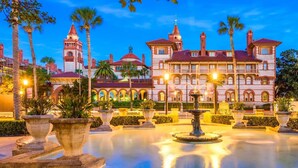 A large, historic building with multiple towers and a courtyard with a fountain. - Walkable Stay Near Flagler College & Historic Site (St. Augustine)