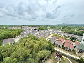 A residential area with multiple houses, a gazebo, and a water tower in the distance. - Royal Oceancrest Panglao 1 (Dauis)
