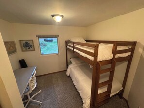 A bunk bed room with a desk and a window. - Private Mission Lake retreat: hot tub, dock, paddleboards & record player (Bremerton)