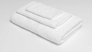 A white towel folded neatly. - SEC Battle! Americas Best Value Holly Springs! Two Double Beds. One Night. (Holly Springs)