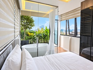 A modern bedroom with a large bed, a glass door leading to a balcony, and a view of the cityscape. - An Home (Ngoc Ha)