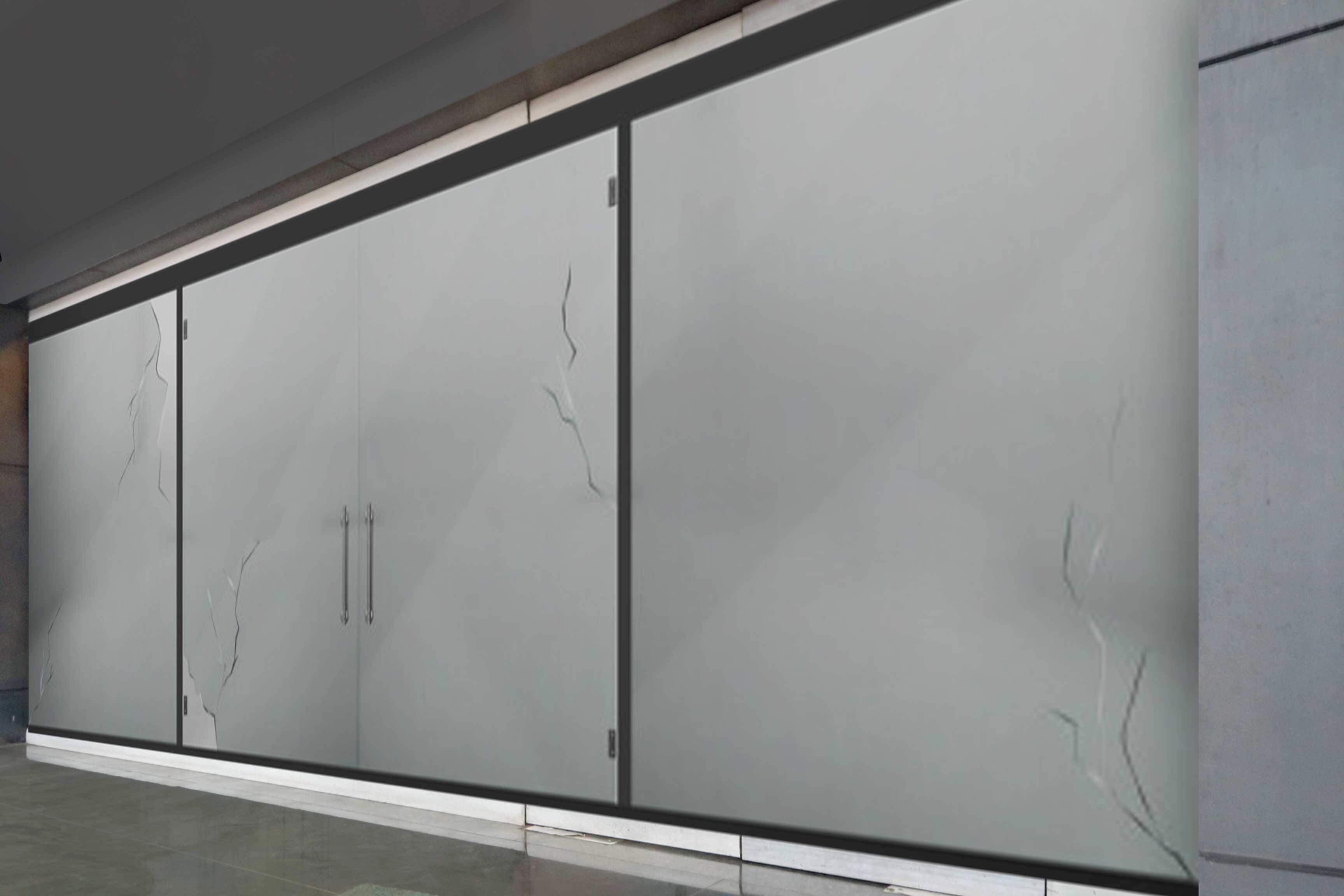 A large, modern room with a long, narrow cabinet with two handles and a large, plain wall.