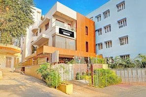 A multi-story building with a sign indicating it is a serviced company townhouse. - Townhouse Seethammadhara Junction (Visakhapatnam)