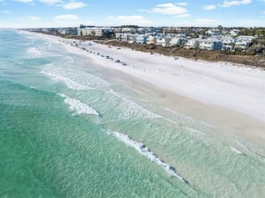 An aerial view of a beach with a row of houses along the shore. - Private Beach Access And Pool/Amazing Gulf Views (Santa Rosa Beach)