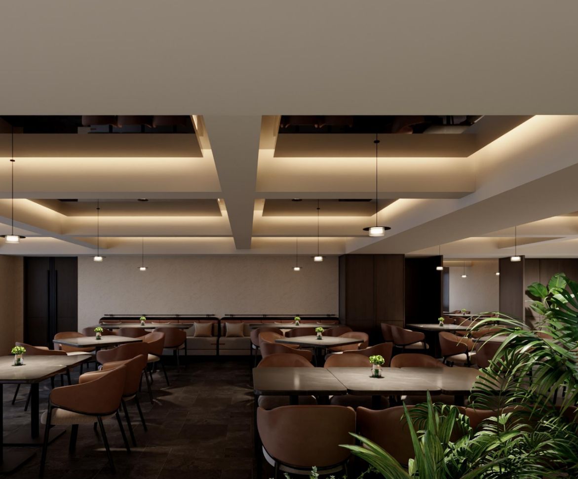 A modern dining area with tables and chairs, pendant lighting, and a large plant in the foreground.