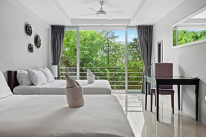 A modern hotel room with two beds, a desk, and a balcony with a view of greenery. - Golf view, pool villa. 5 Bed/Bath. 7 kms to Patong. Peaceful & private (Tambon Kathu)