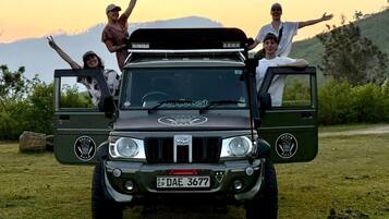 A vehicle with a roof rack and a license plate.
