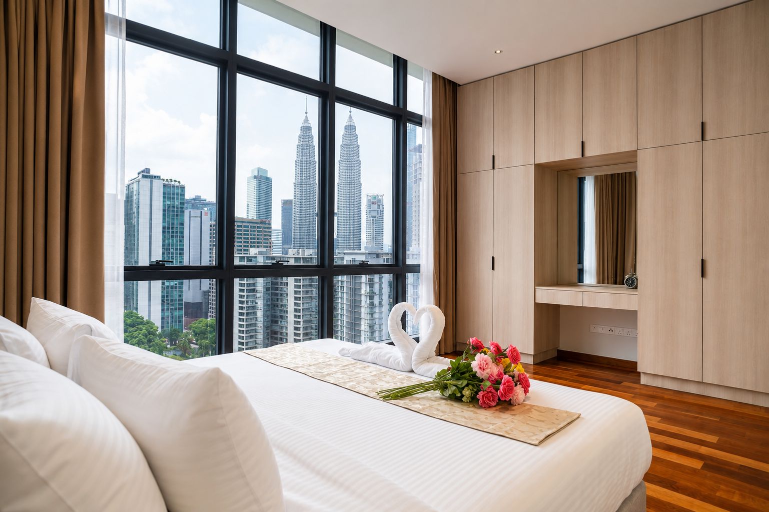 A hotel room with a large window, a bed, a wardrobe, and a bouquet of flowers.