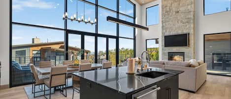 Cook, dine, and gather in the stylish open-concept kitchen and dining area.