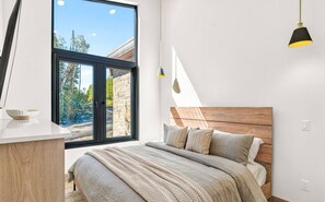 Another inviting view of the bedroom, filled with natural light and cozy details.
