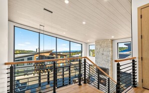 Enjoy the open feel of the home’s upper-level landing with beautiful views beyond.