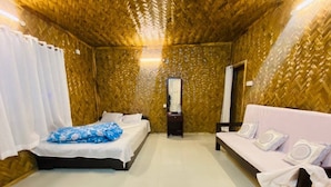 A room with two beds, a sofa, a mirror, and a small table. - Ratnodwip Beach View Resort (Cox's Bazar)