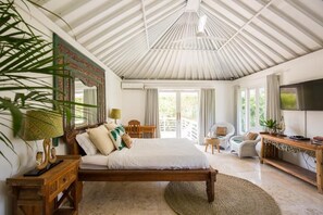 A bedroom with a bed, a desk, a chair, and a television. - 4 bedroom villa in Canggu, 2 minutes walk to the beach (canggu)