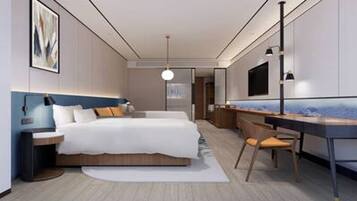 A modern bedroom with a bed, bedside table, desk, chair, and a large mirror.