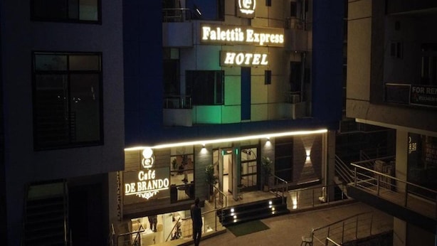 A hotel with a sign for 'Palettis Express Hotel' and a cafe named 'Cafe De Brando' below it. - Faletti's Express - Islamabad (Islamabad)