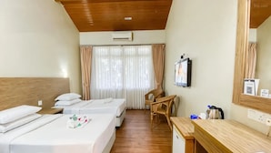 A hotel room with two beds, a desk, a chair, a television, and a mirror. - Lilla Sea View Retreat, Malacca (Alor Gajah)