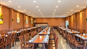 A large dining hall with multiple tables and chairs, arranged in rows. - Mangrove Resort Phuket Airport (Thalang)