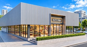 A modern building with a 'Duty Free' sign, large glass windows, and a clean, contemporary design.