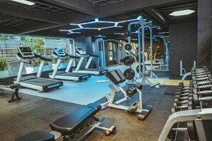 A gym with treadmills, weight machines, and free weights. - Cozy 1-bedroom apartment with gym, swimming pool in fabulous Nairobi Lavington (Nairobi)