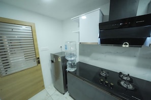 Deluxe Triple Room | Private kitchen - Kay Pee's Grande (Kochi)