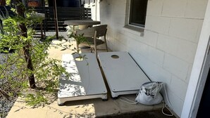 A room with a bed, a bedside table, and a window. - Serene Ranch Guesthouse with Fire Pit & Pond Views in Decatur, Texas (Decatur)