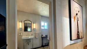A bathroom with a double sink, a mirror, and a towel rack. - Serene Ranch Guesthouse with Fire Pit & Pond Views in Decatur, Texas (Decatur)