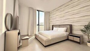 A modern bedroom with a large bed, a bedside table, a mirror, and a potted plant.