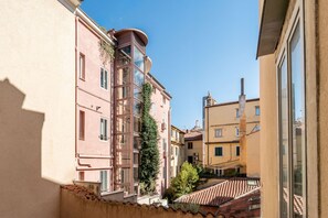 A narrow street with buildings on either side, featuring balconies and a clear sky. - A comfortable and bright 74 square meters apartment, perfect for four people, located on the second floor of a period building (no elevator).The property is situated near the Ospedale Maggiore in Trieste and a short distance from the city center; guests  (Trieste)