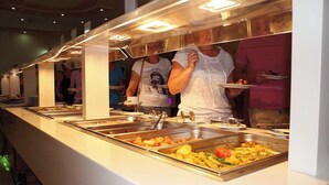 A buffet line with multiple food stations. - Offra Douz  (Ghlissia)