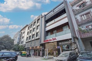 A multi-story building with a storefront labeled 'Kashima Int. LUV FASHIONS.' - Hotel Saina International - Newly Built  (New Delhi)