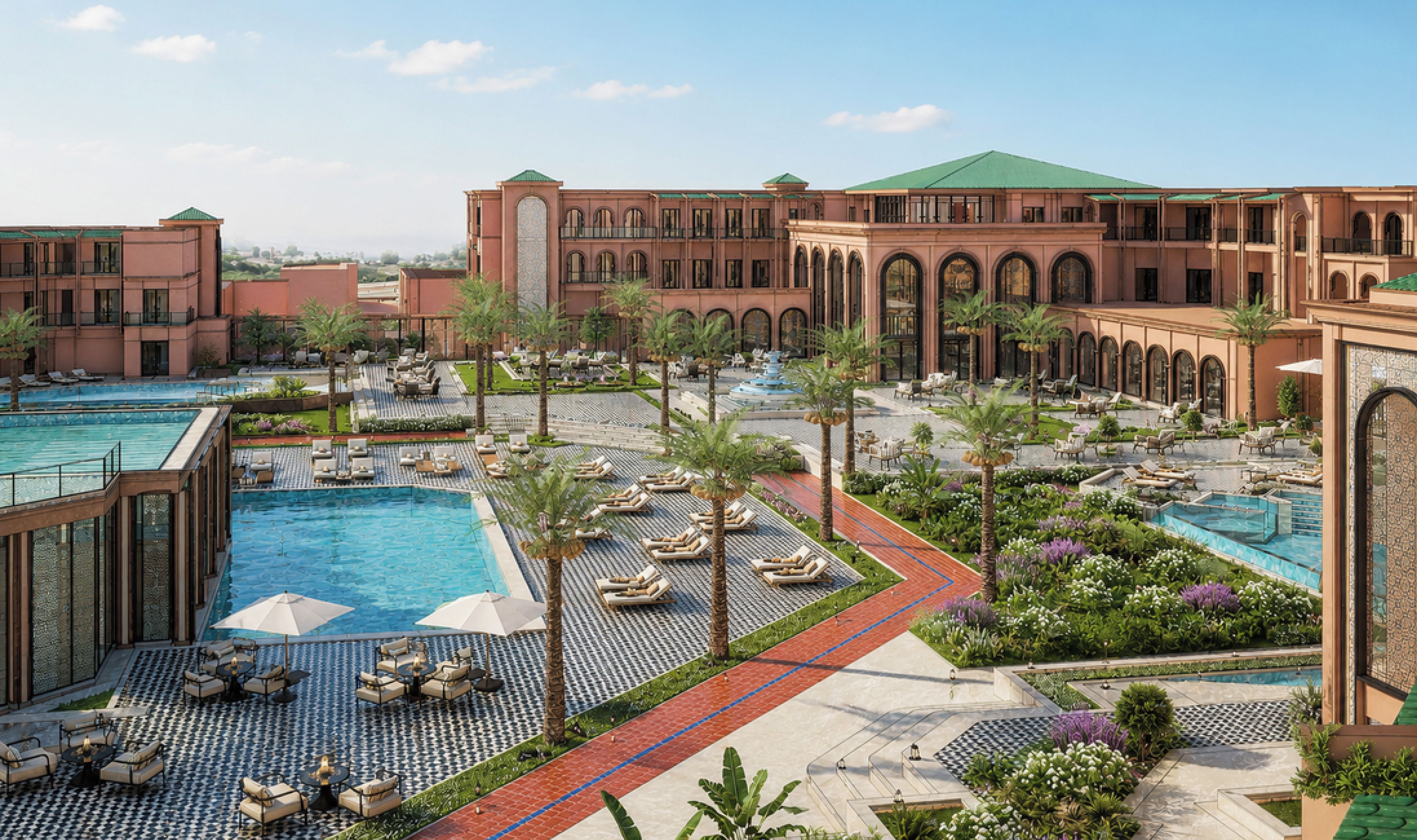 Un complexe hôtelier doté de plusieurs piscines, d’espaces de détente et d’un grand bâtiment orné d’arcades.