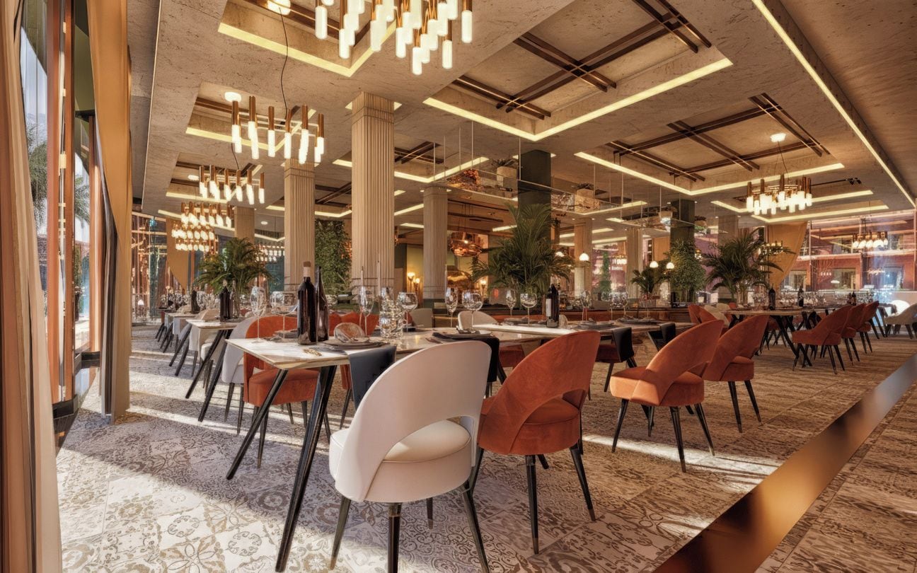 A spacious restaurant with high ceilings, modern lighting, and a variety of seating arrangements.