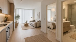 Apartamento moderno com cozinha, sala de estar e quarto.
